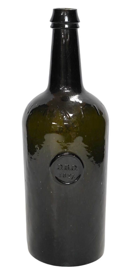 A George IV sealed wine bottle, DBD 1827, moulded script around shoulder, Imperial Patent, 29cm. Condition - commensurate with age